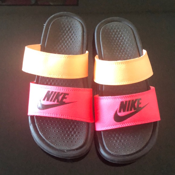 pink and orange nike slides